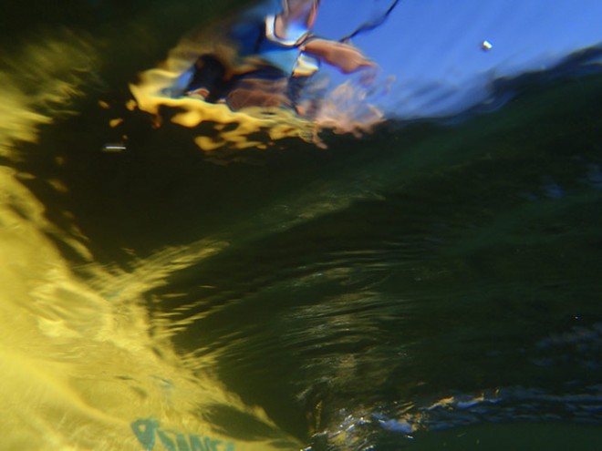underwater photo of Sue kayaking on Vaseux Lake